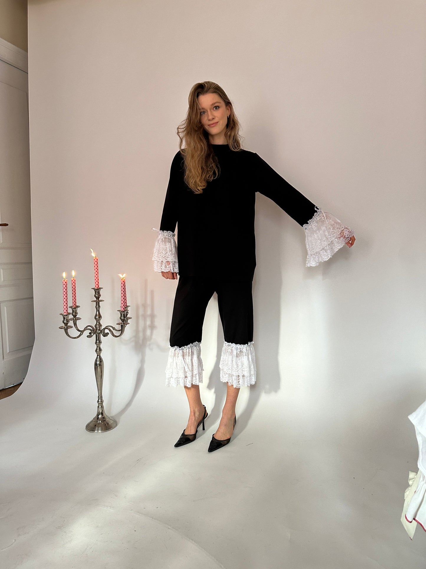 Black jersey white lace capri trousers